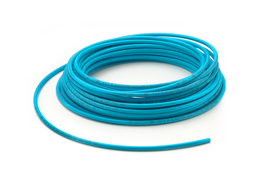 Linear flexible polyamide hose PA 12 self-extinguishing light blue by Mebra Plastik