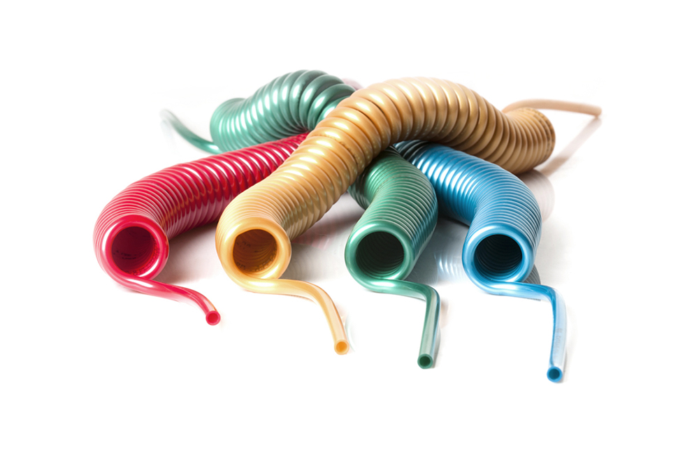 Spiral coiled polyurethane 98 MB-LONGLIFE tubes red, yellow, green and light blue by Mebra Plastik